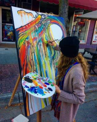 Artist Anneliese Mathia paints at last year's event. Photo by Anneliese Mathia.